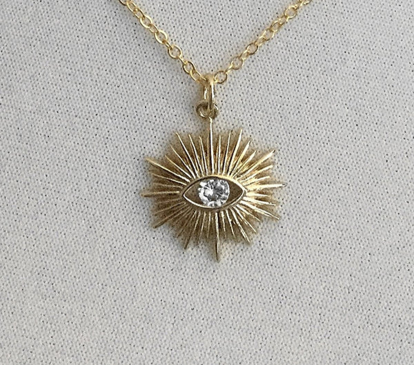 gold evil eye sunburst faceted cubic zirconia necklace