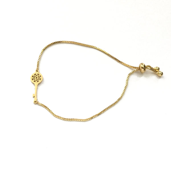 Gold stainless steel key on an adjustable gold stainless steel box chain bracelet