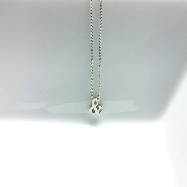 tiny silver matte and symbol charm necklace