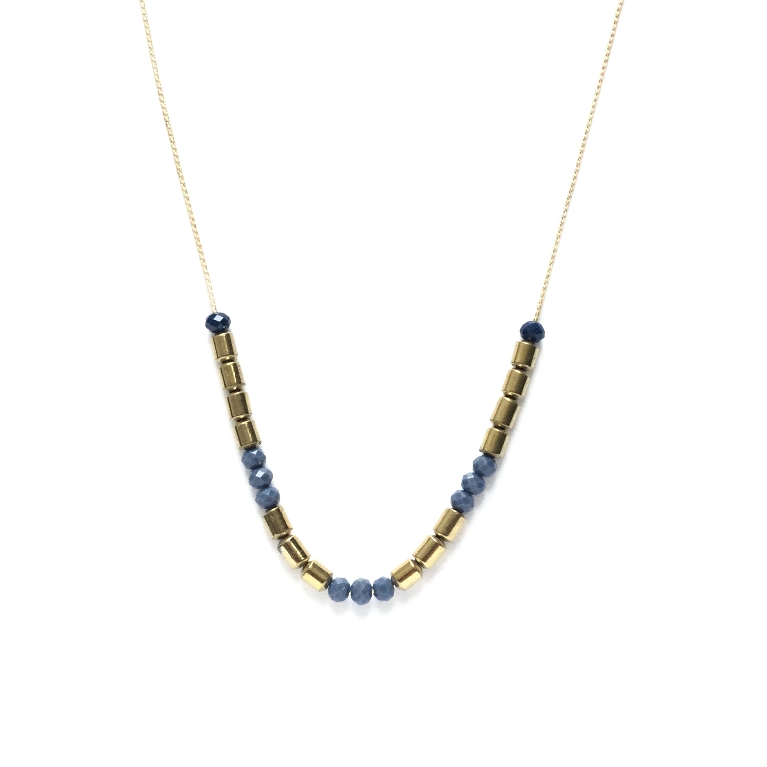 Golden brass tube bead spacers with tiny faceted electric blue glass beads on a thread chain necklace