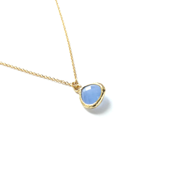 Gold plated drop light blue blue faceted glass teardrop pendant on a gold plated chain necklace
