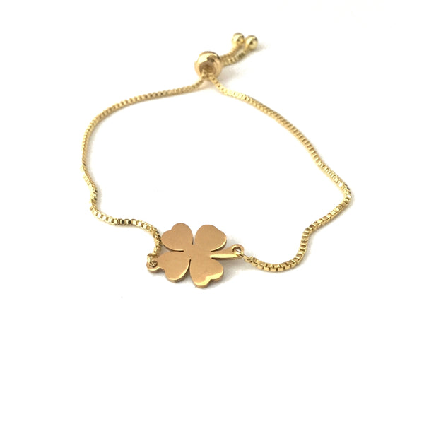 Gold stainless steel polished four leaf clover pendant on a gold stainless steel adjustable bracelet