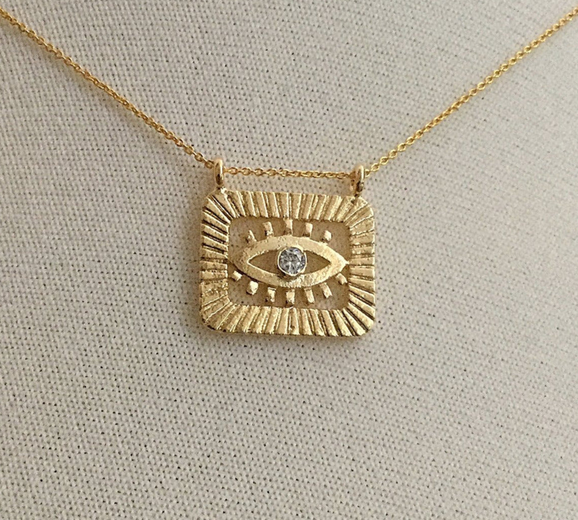 gold evil eye medallion cubic zirconia necklace