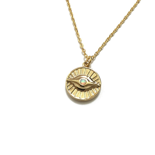 Gold plated evil eye coin with an opal necklace