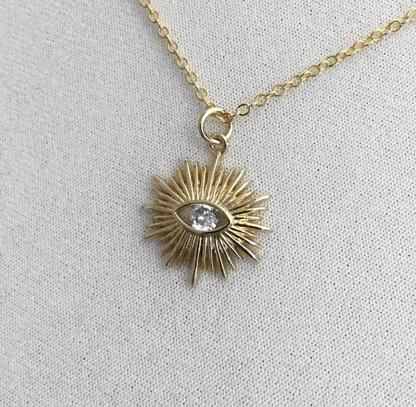 gold evil eye sunburst design faceted cubic zirconia stone necklace