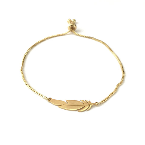 Gold stainless steel feather on an adjustable gold stainless steel bracelet