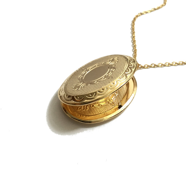 Gold plated oval floral design locket necklace