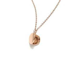 Tiny rose gold round locket necklace