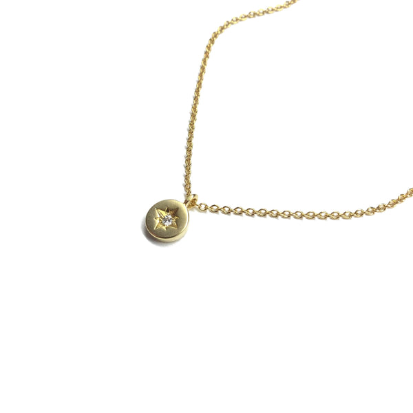 Tiny gold plated cubic zirconia star coin necklace